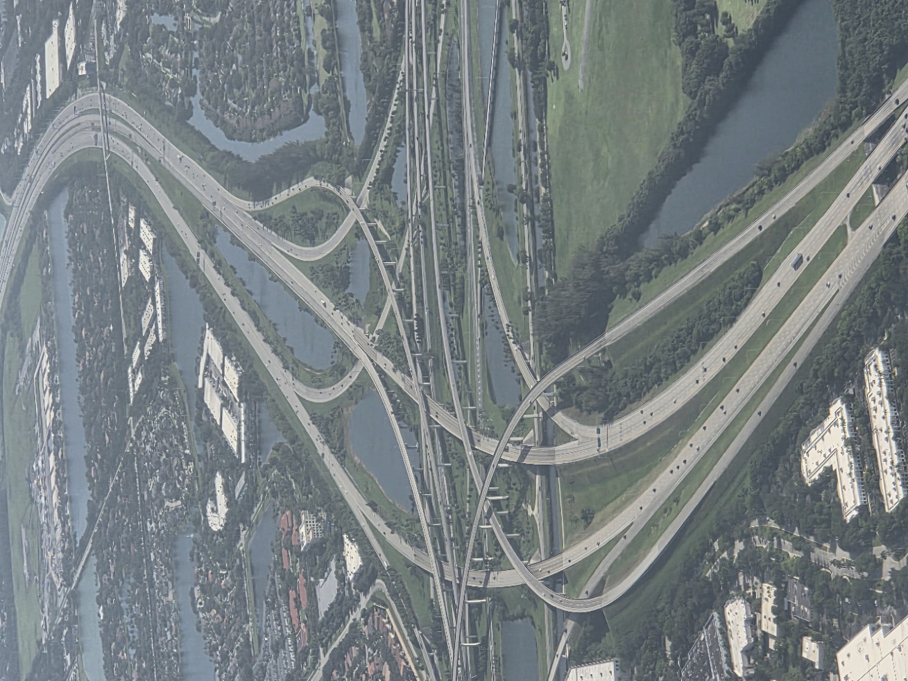 Aerial view of a complex highway interchange with multiple overlapping roads crossing in every direction